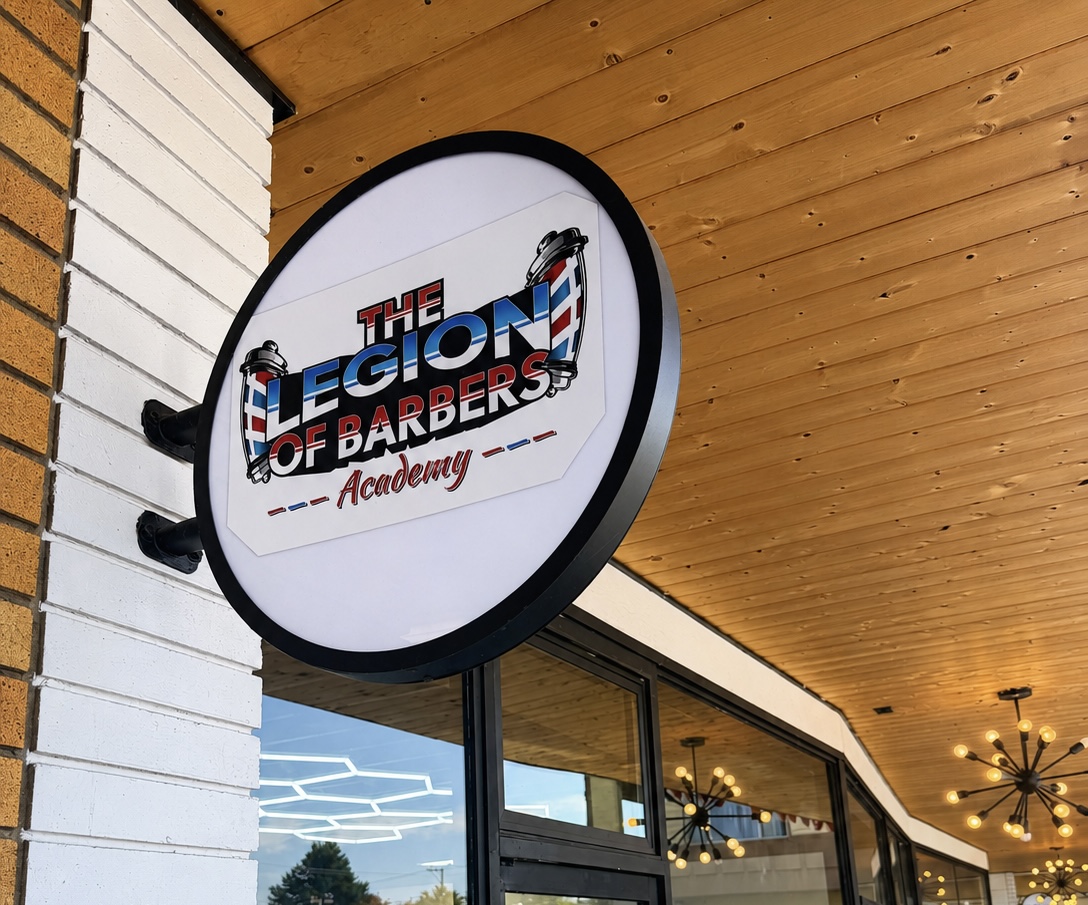 The Legion of Barbers Academy storefront sign